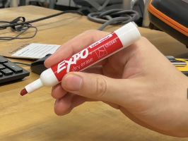 Hand holding the marker in the video